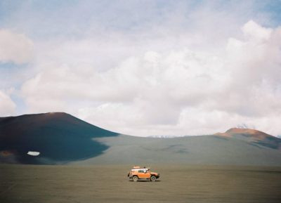 orange vehicle on brown sand 1553962 1 650x470 1 1