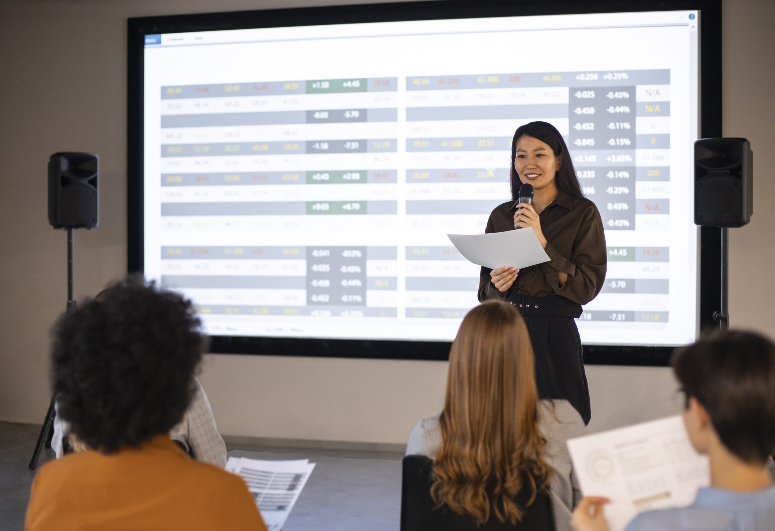 Speaker addressing an audience in a conference room